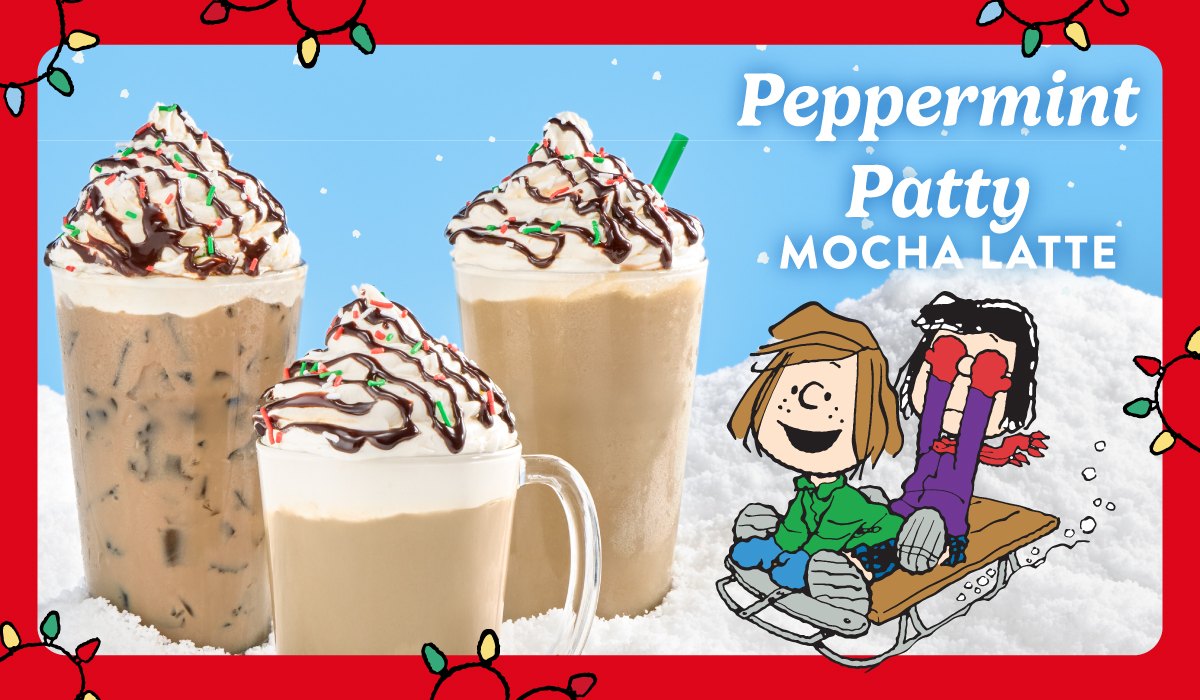 Peppermint Patty Mocha Latte topped with whipped cream, chocolate drizzle, and Christmas sprinkles.